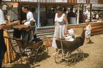 Children in Antique Strollers on Festival Grounds by Richard Hoffman