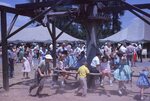 Children Play on Horse Mill on Festival Grounds by Richard Hoffman