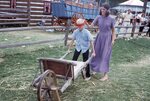 Blinded Wheelbarrow Race on Festival Grounds by Richard Hoffman