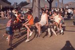 Children Play on Horse Mill on Festival Grounds by Richard Hoffman