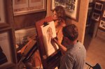 Artist Draws Woman's Portrait by Richard Hoffman