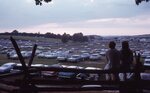 Couple Overlooks Festival Parking Lot by Richard Hoffman
