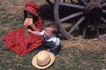 Children Eat Cookies on Festival Grounds by Richard Hoffman