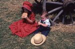 Children Eat Cookies on Festival Grounds by Richard Hoffman