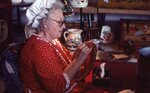 Woman Paints Ceramic Dish by Richard Hoffman