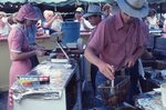 Frying and Serving Food at Food Stand by Richard Hoffman