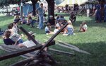 Visitors Resting on Festival Grounds by Richard Hoffman