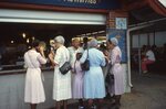 Women in Mennanite Prayer Caps At Food Stand by Richard Hoffman