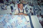 Man with Rows of Quilts by Richard Hoffman