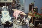 Decorative Display with Doll and Furniture on Festival Grounds by Richard Hoffman