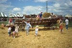 Children Play on Wooden Wagon Frame on Festival Grounds by Richard Hoffman