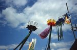 Yard Flags and Decorations Hang Above Festival Grounds by Richard Hoffman
