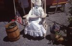 Display with Doll on Festival Grounds by Richard Hoffman