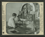 Cutting Out Boys' Pants with a Band Saw Cloth Cutter. by Keystone View Company