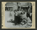City Blacksmith Shoeing Buffalo on Streets of Tarsus, Turkey in Asia. by Keystone View Company